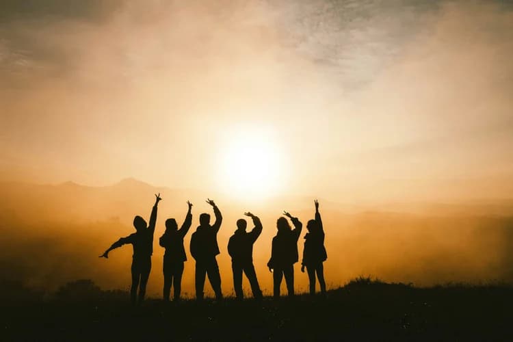 People together in warm evening light