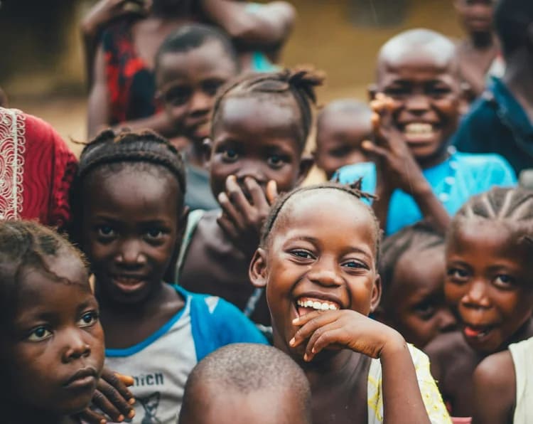 Children gathered together and smiling